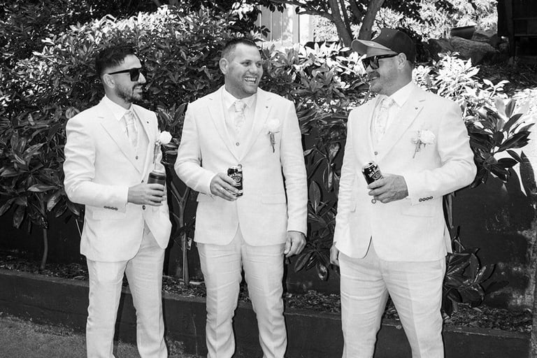 Groomsmen portrait laughing outdoors Avalon Castle Melbourne wedding candid moment