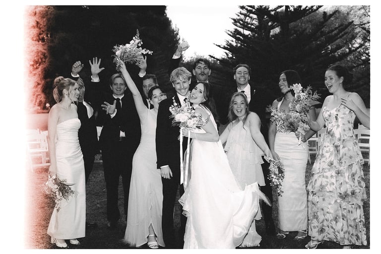 Bride and groom celebrating with their bridal party after the ceremony