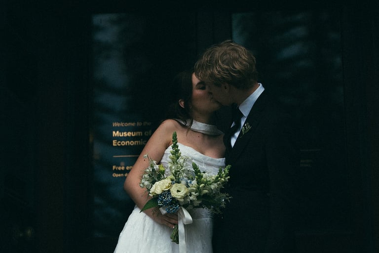 Bride and groom sharing a quiet moment outside the museum at Adelaide Botanic Garden