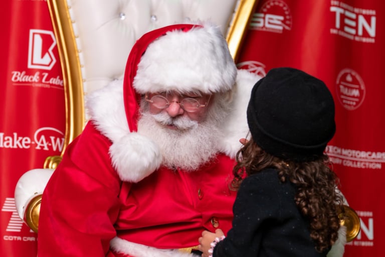 The santa Cowboy being told a secret Christmas wish
