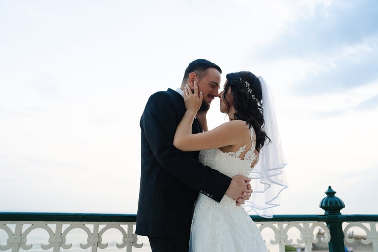 bride and groom close to each other smiling 