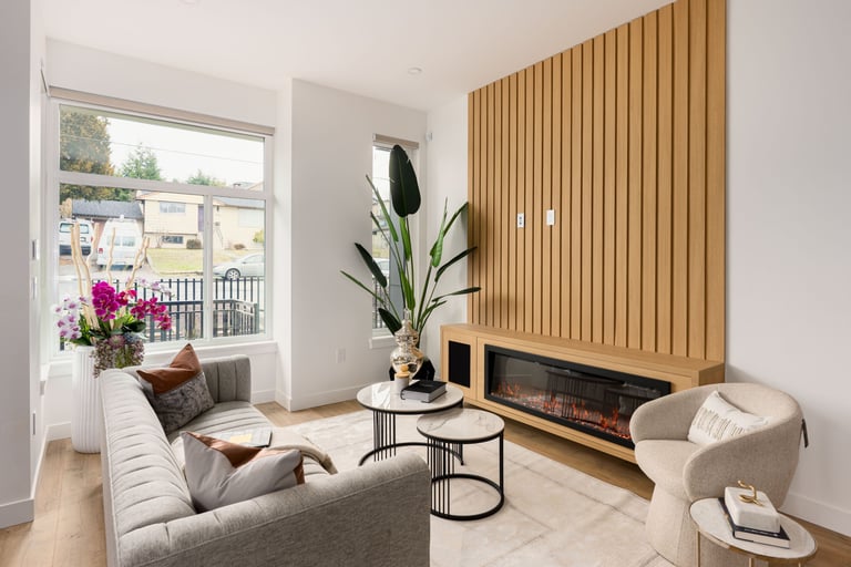 Professionally staged modern living room with neutral tones, designer furniture, and decor.