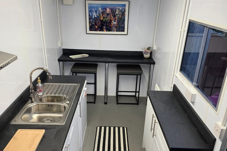 Interior of a fully equipped temporary kitchen pod provided during insurance claims and home renovation projects.