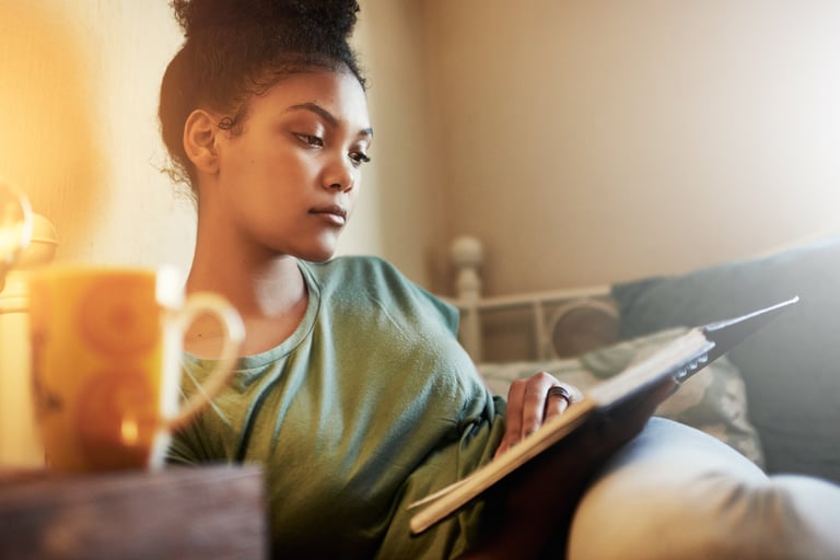 Cropped shot of a young female student studying at home