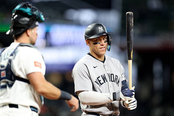 - APRIL 01: Aaron Judge #99 of the New York Yankees looks at Cal Raleigh #29 of the Seattle Mariners in Seattle, Washington