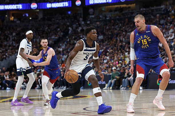 Anthony Edwards and Nikola Jokic during game 2 of the Wolves-Nuggets 1st round match-up (2026)