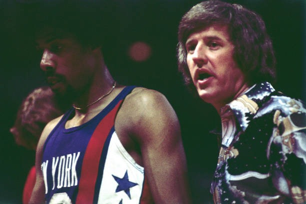 Julius Erving and New York Nets head coach Kevin Loughery on the sideline during an ABA game