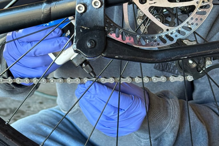 bike chain being lubricated