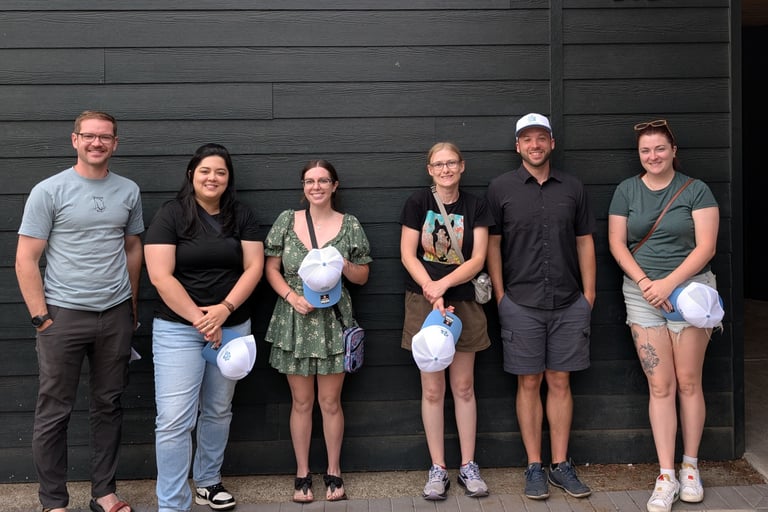 oly paws team members standing in front of a wall