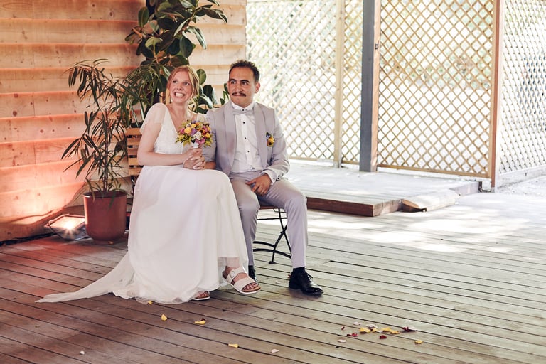 Bride and groom listening to wedding speeches.