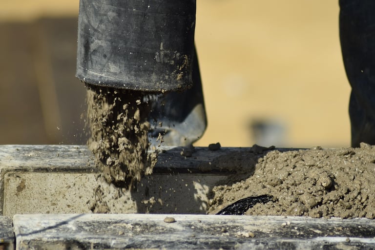  a cement mixer to make a concrete block