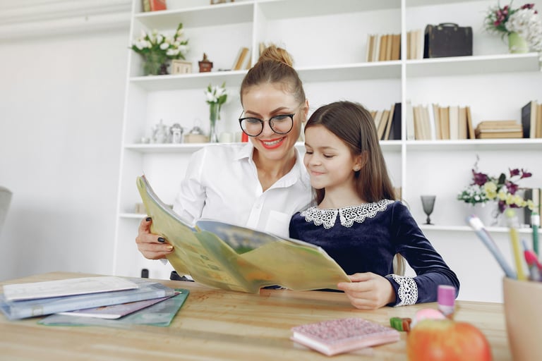 "Teacher providing guidance to a young student, ensuring clear understanding of the material."