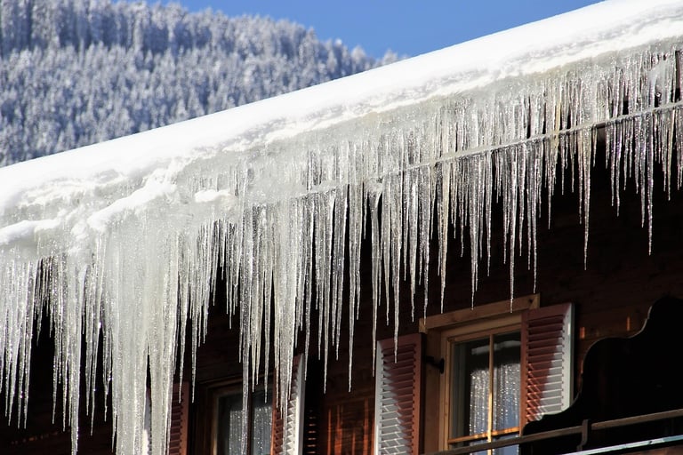 “Icicles on roof — exterior home check for winter storm damage