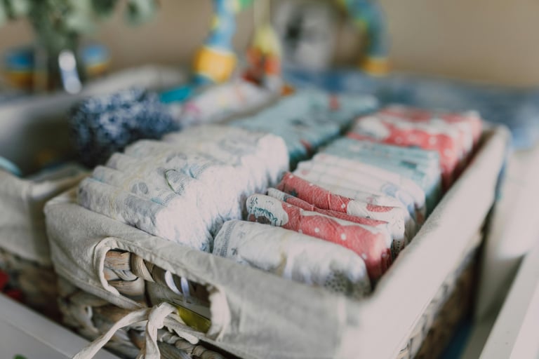 Diaper changing setup with wipes, cream, and diapers in an organizer