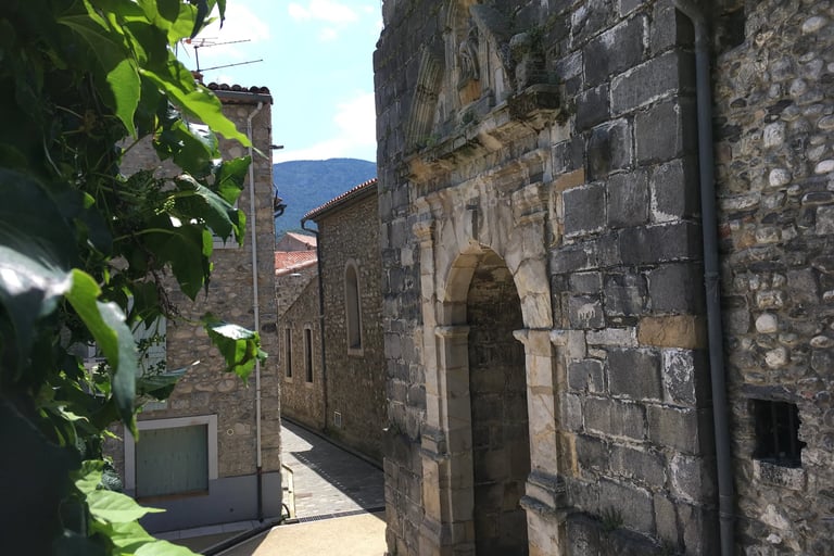 Bedroom with balcony and church view in Quillan holiday home