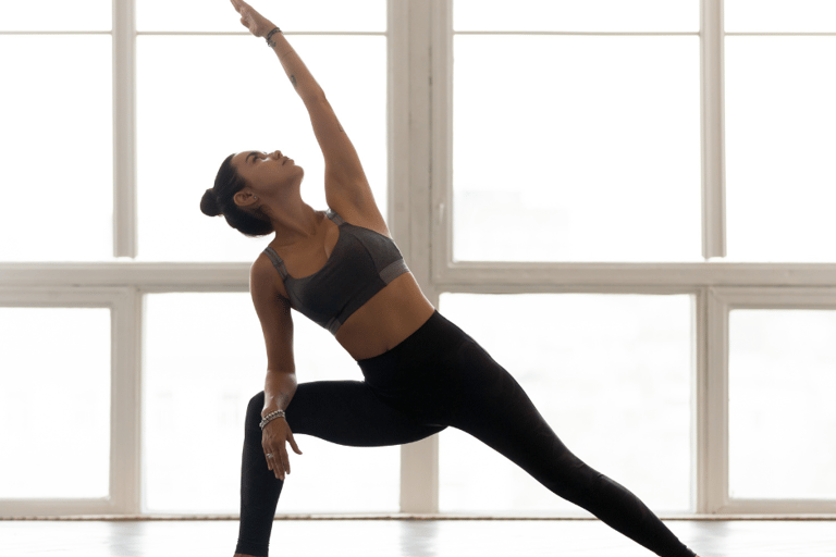 a woman in a sports bra top doing yoga