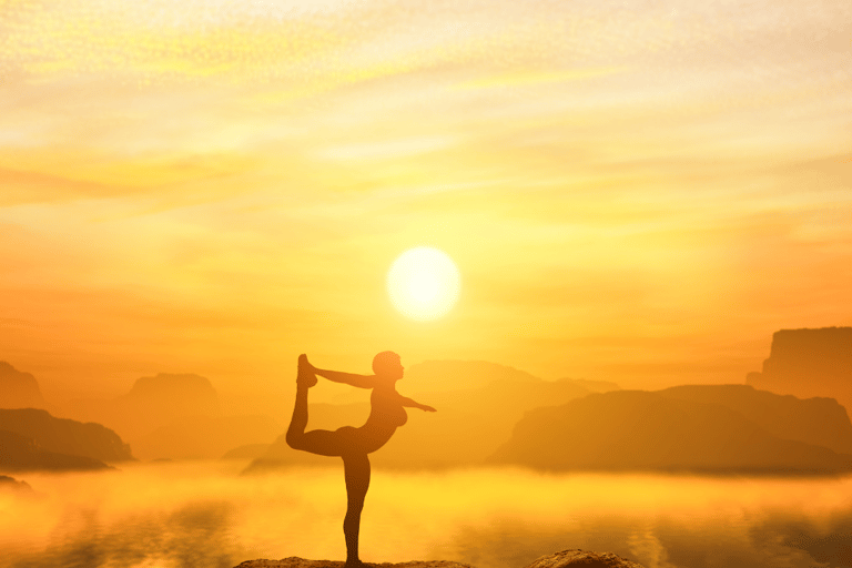 a person doing yoga on a mountain top
