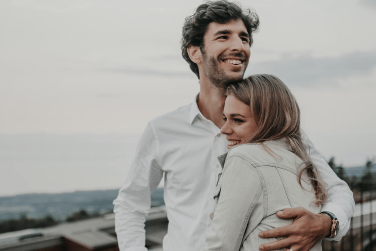 a man and woman standing next to each other