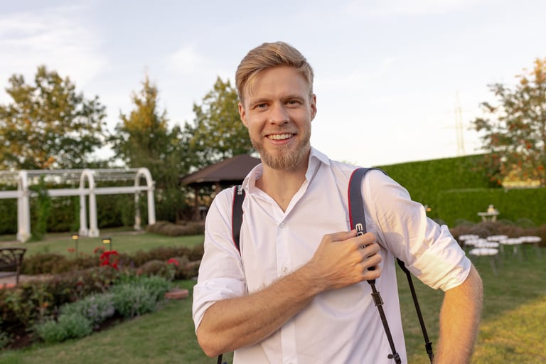 a man photographer with big smile