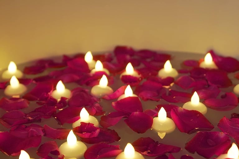 a bowl of candles with candles on a table