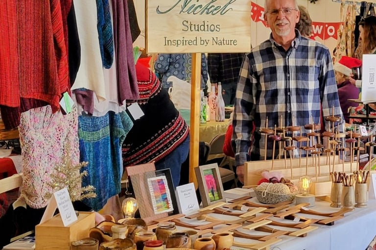 Photo of Nickel Studios vendor table at a fiber conference. Depicts items listed on this website. 
