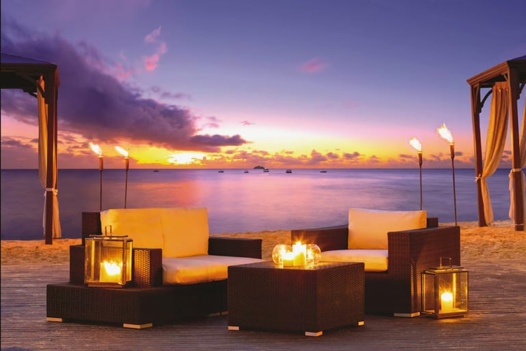 Romantic Barbados beach at sunset with golden sky and ocean waves, capturing the beauty of a Caribbe