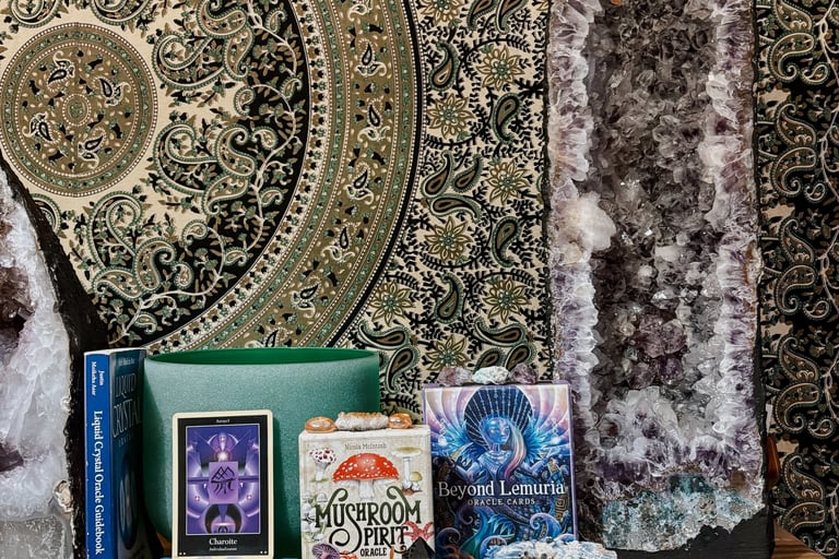 a table with a bunch of crystals and tarot oracle deck