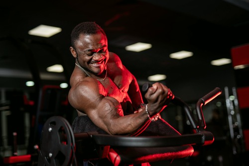 a man using a machine for curls