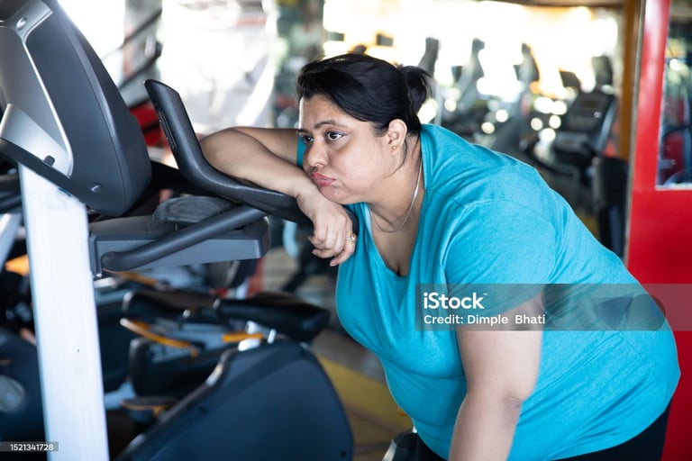 a woman in a blue shirt is standing in front of a machine