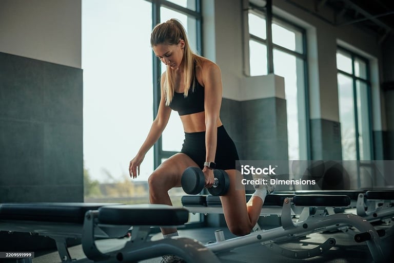 a woman doing a squat on a bench