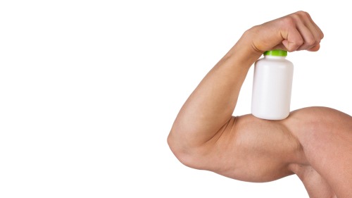 a muscular arm holding a bottle
