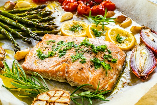 Salmon and vegetables on a baking sheet