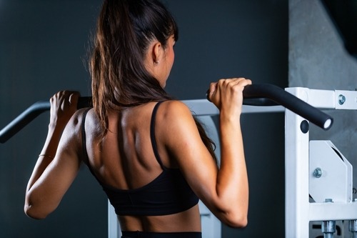 a woman using an exercise machine