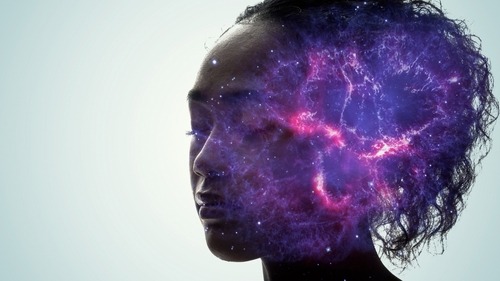 a person with a purple and blue galaxy - like body