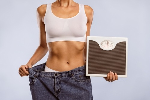 a woman with a weight scale
