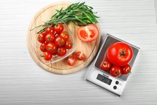 a food scale with vegetables on it