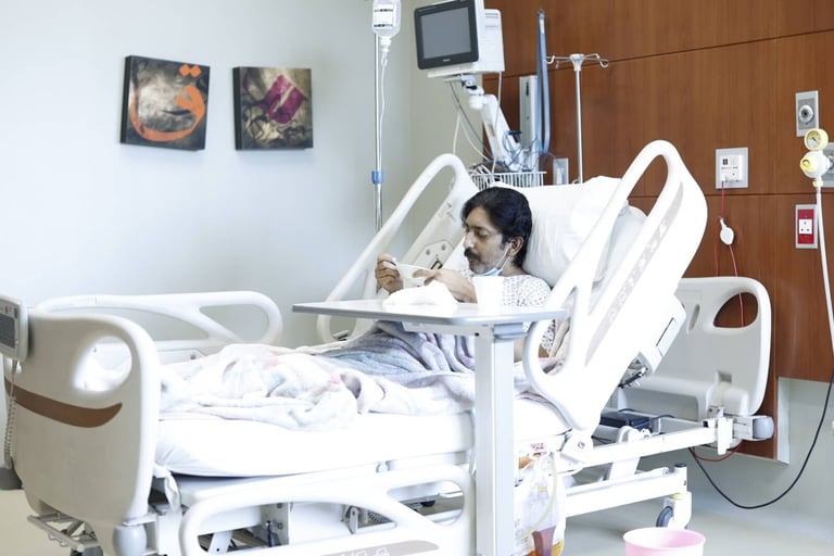 a woman in a hospital bed with a baby in her arms
