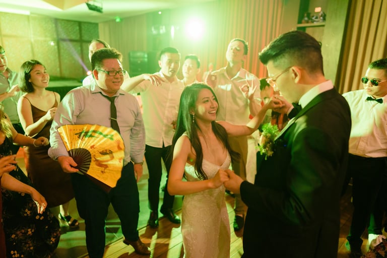 a man and woman dancing at a wedding