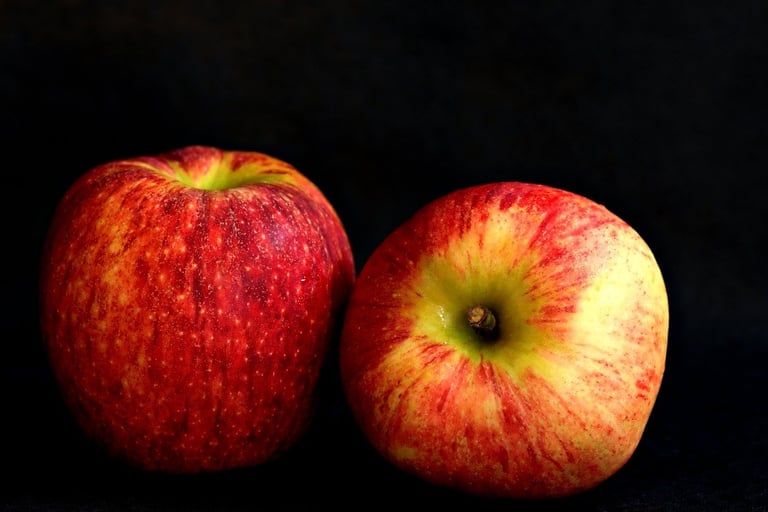 fuji apples with black background
