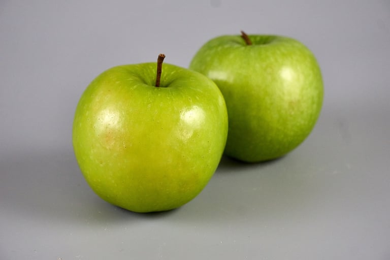 granny smith apples with grey background
