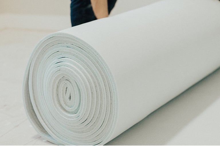 a carpet being rolled out for new room in Sugar Land TX