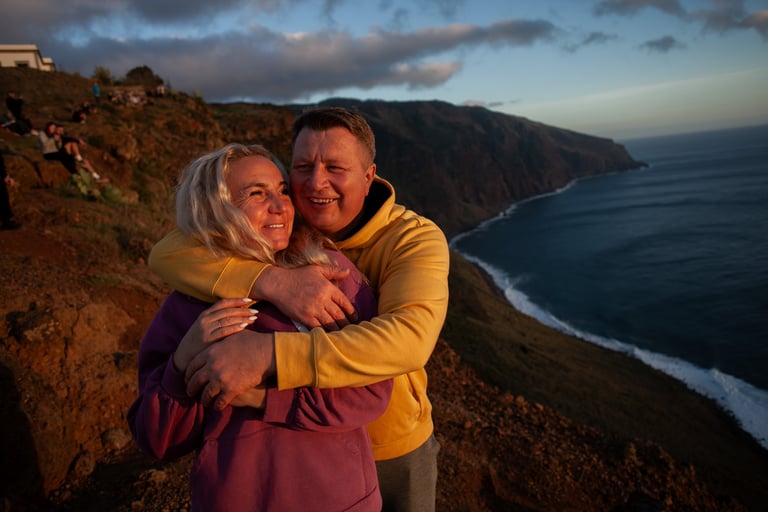 Couple embracing at Ponta do Pargo during twilight sunset