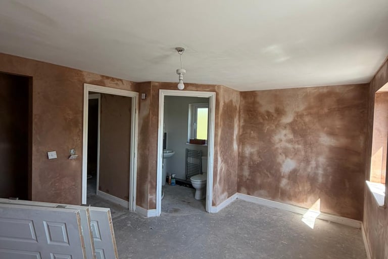Professional plastering complete leaving smooth walls ready for decoration.