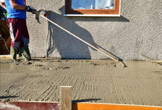 a man is using a concrete flooring machine