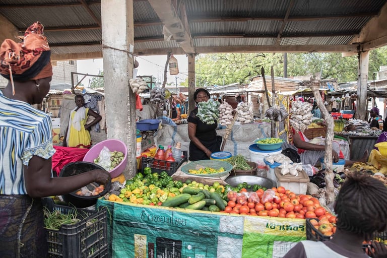 In West Africa, ex-farming women seek market jobs as farming no longer sustains their families.