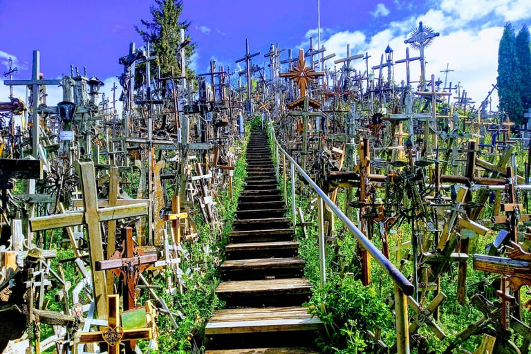 A wooden staircase leads through thousands of crosses at the Hill of Crosses in Lithuania.