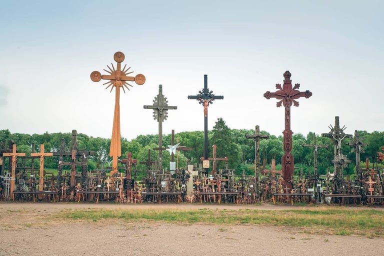 Thousands of ornate wooden and metal crosses at the Hill of Crosses pilgrimage site in Lithuania.