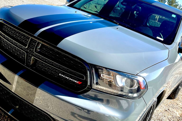 Glossy Nardo Grey color change with black racing stripes on a Dodge Durango, Las Cruces, NM