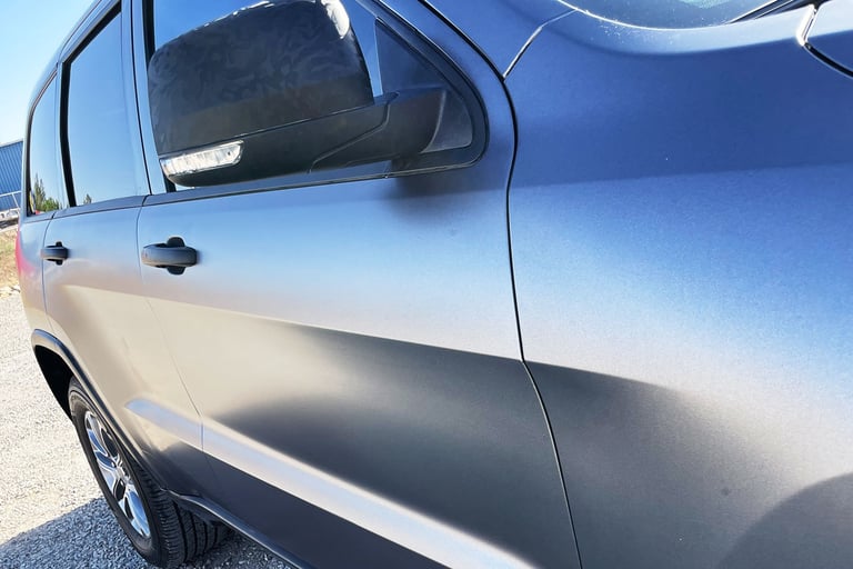 Color change vinyl wrap on a jeep grand cherokee in satin grey vinyl, in Las Cruces, NM at www.elitecarwrapsinlc.com