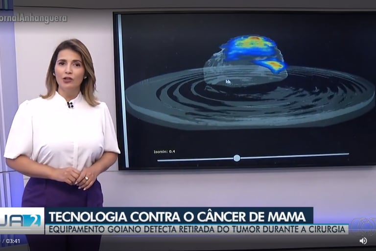 a woman in a white shirt and purple pants standing in front of a television screen